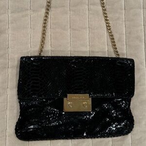 Michael Kors black clutch with shoulder strap
